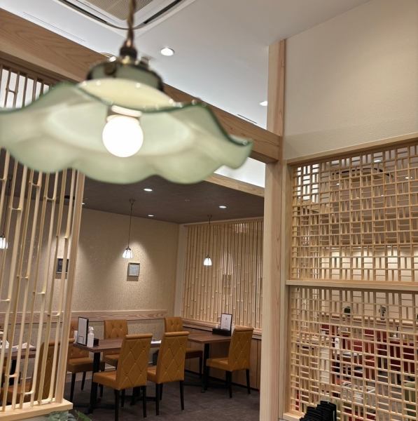 It is a calming space with bamboo objects and plain wood, where you can relax and enjoy your time.The pendant light above the cash register is antique.