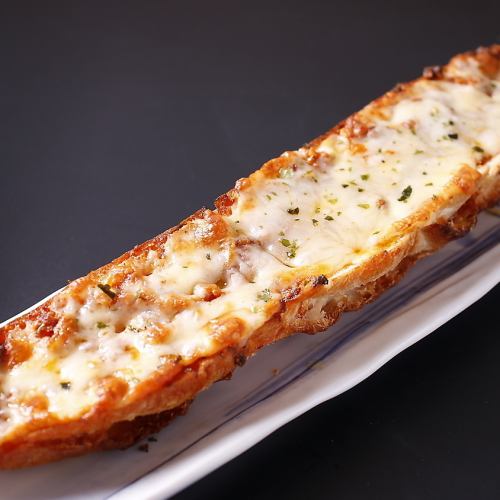 Long baguette cheese grilled with spicy garlic