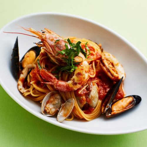 Pescatore with seafood and ripe tomatoes