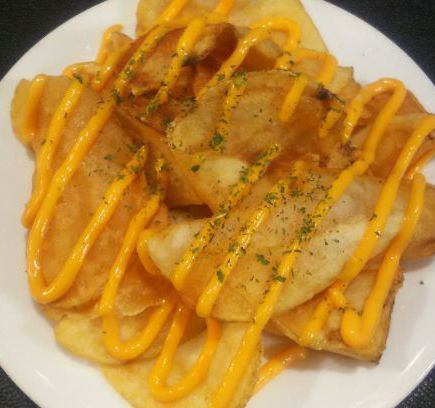 Freshly fried potato cheese sauce