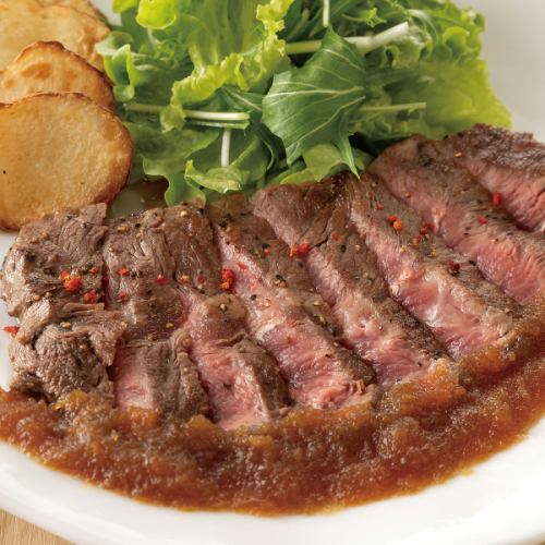 Beef top steak with grated onion and apple sauce