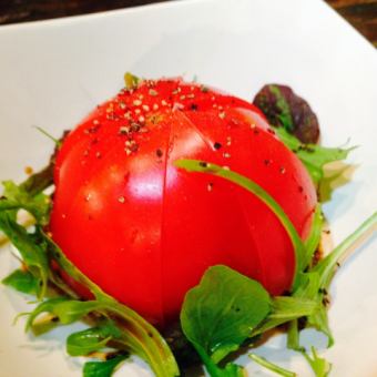 Chilled whole tomato with refreshing green onion sauce