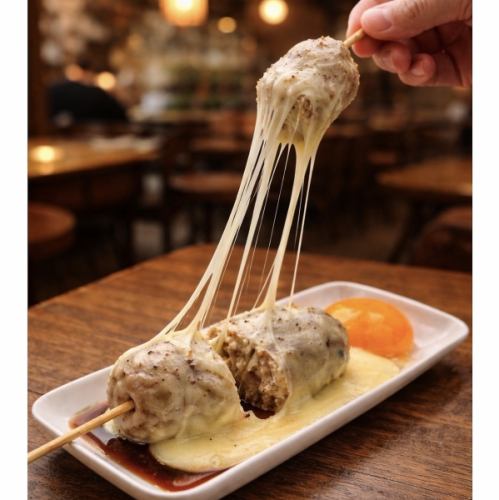 A highly popular menu item: luxurious chicken meatballs coated in runny egg and rich cheese.