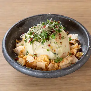 Potato salad with soft-boiled egg and crispy cheese