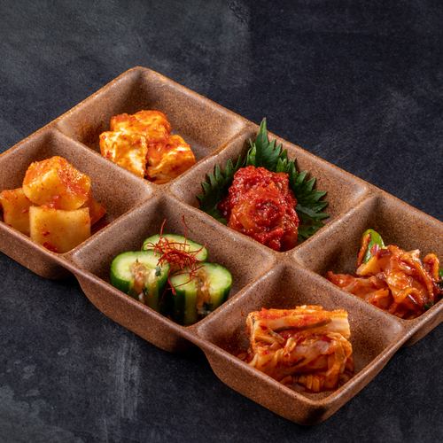 Assortment of 6 colorful kimchi dishes