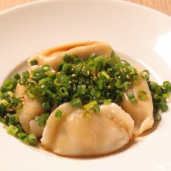 Boiled gyoza with green onion pon