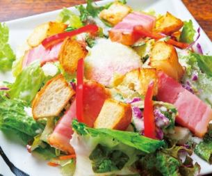 Caesar salad with thick-sliced bacon and warm croutons