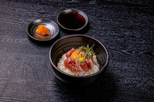 Small bowl of sesame and soy sauce with tuna