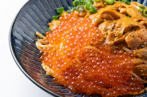 Cream pasta drowning in large thick sea urchin and salmon roe