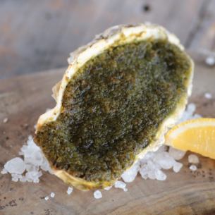 Grilled oysters with herbs and garlic