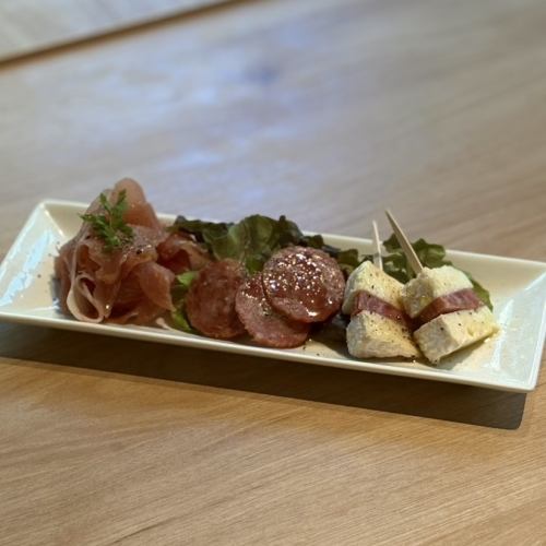 Assorted raw ham and Camembert salami