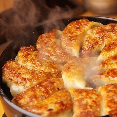 Juicy homemade gyoza with meat juices overflowing from the inside!