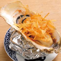 Grilled oysters in broth