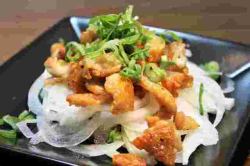 Crispy chicken skin tossed in ponzu sauce