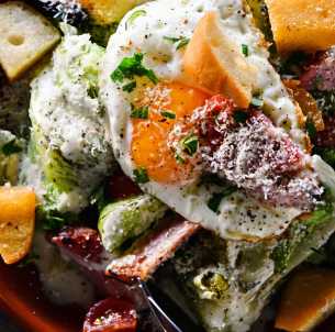 Grilled lettuce and soft-boiled egg Caesar salad