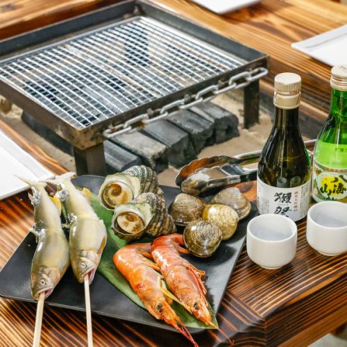自分で焼いて楽しめる!名物『囲炉裏海鮮セット』
