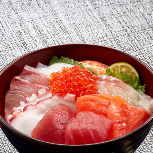 Bowl of rice topped with sashimi