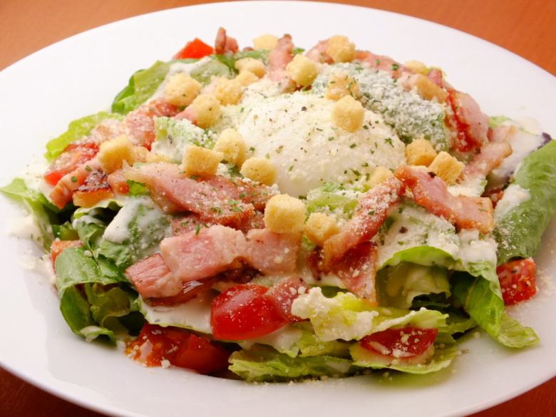 Caesar salad with hot balls and bacon