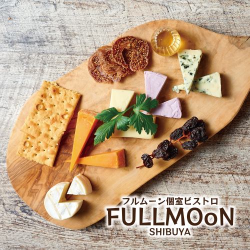 5 types of cheese platter on a stump