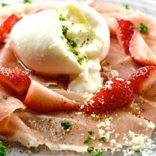 Melty burrata cheese and prosciutto served with seasonal fruits