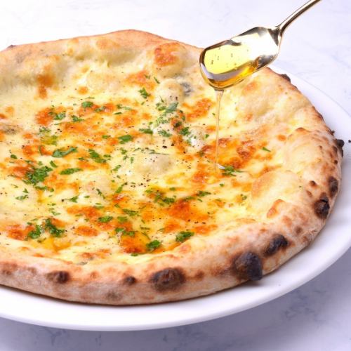 Quattro formaggi with carefully selected cheese served with honey