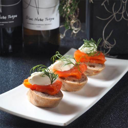 Mini open sandwich with homemade smoked salmon and clotted cream