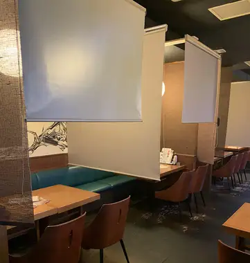 You can use the roll-up curtain to create a private room-like space.