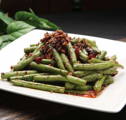 Fried green beans with chili peppers