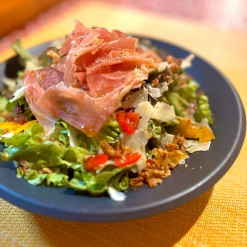 Italian salad with prosciutto and cheese