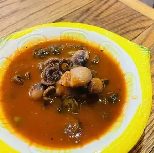 Baby octopus stewed in tomato sauce