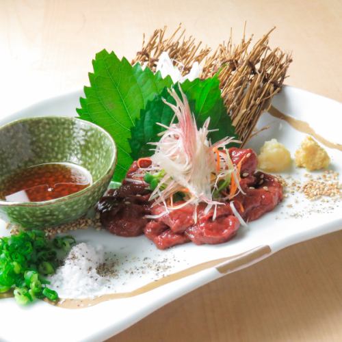 Raw liver served with roasted sesame oil