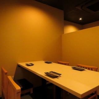 We can accommodate groups of up to 14 people using two tables separated by a wall.