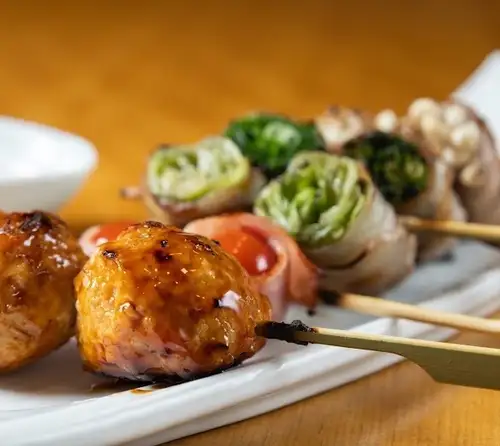 A specialty dish originating in Hakata: "Kyushu Meat-Wrapped Skewers"