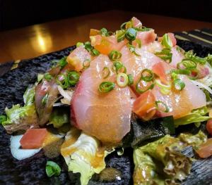 Fresh fish sashimi salad with special soy sauce dressing