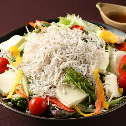 Boiled whitebait and tofu salad with yuzu citrus, topped with dried bonito flakes.
