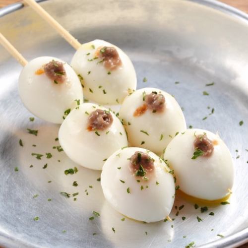 Soft-boiled quail eggs (topped with anchovies)