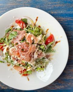 Italian salad with raw ham and cream cheese