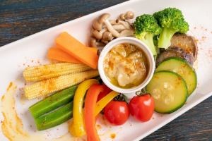 Homemade bagna cauda with seasonal vegetables