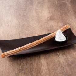 Freshly fried long churros