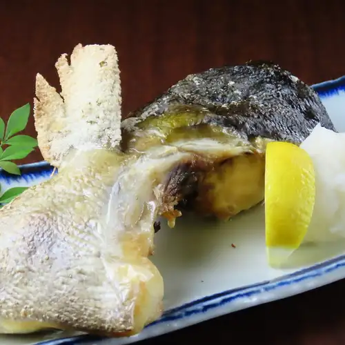 Grilled amberjack collar with salt