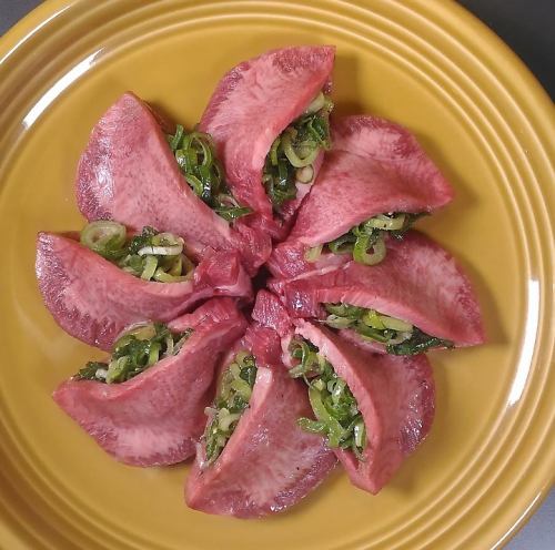 Thick sliced tongue wrapped in green onions