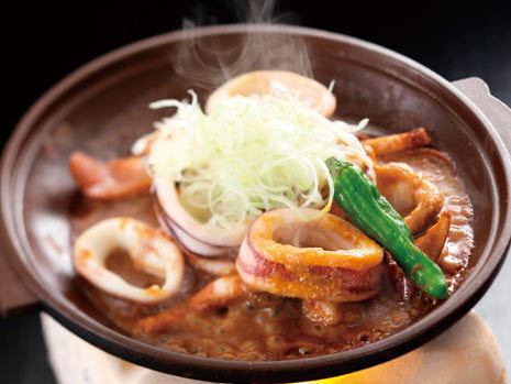 Grilled squid guts on a ceramic plate