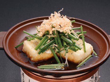 Deep-fried tofu covered in green onions