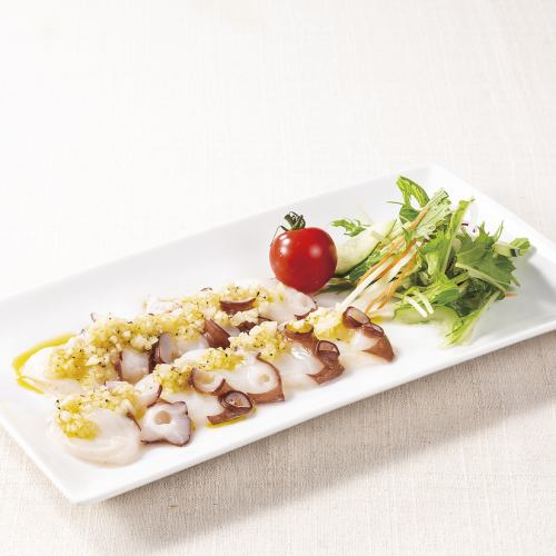 Raw octopus carpaccio with pepper oil sauce