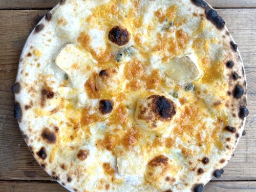 Four kinds of cheese pizza "Quattro Formaggi" with raclette cheese
