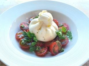 Specialty Caprese salad with homemade burrata cheese