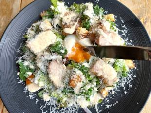Caesar salad with plenty of cheese and roast chicken
