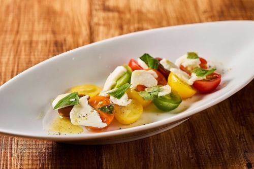 Colorful cherry tomato and buffalo mozzarella caprese