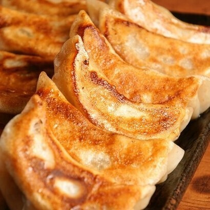 We have dumplings, of course, but also fried chicken with chili sauce and more! Solo diners are more than welcome!