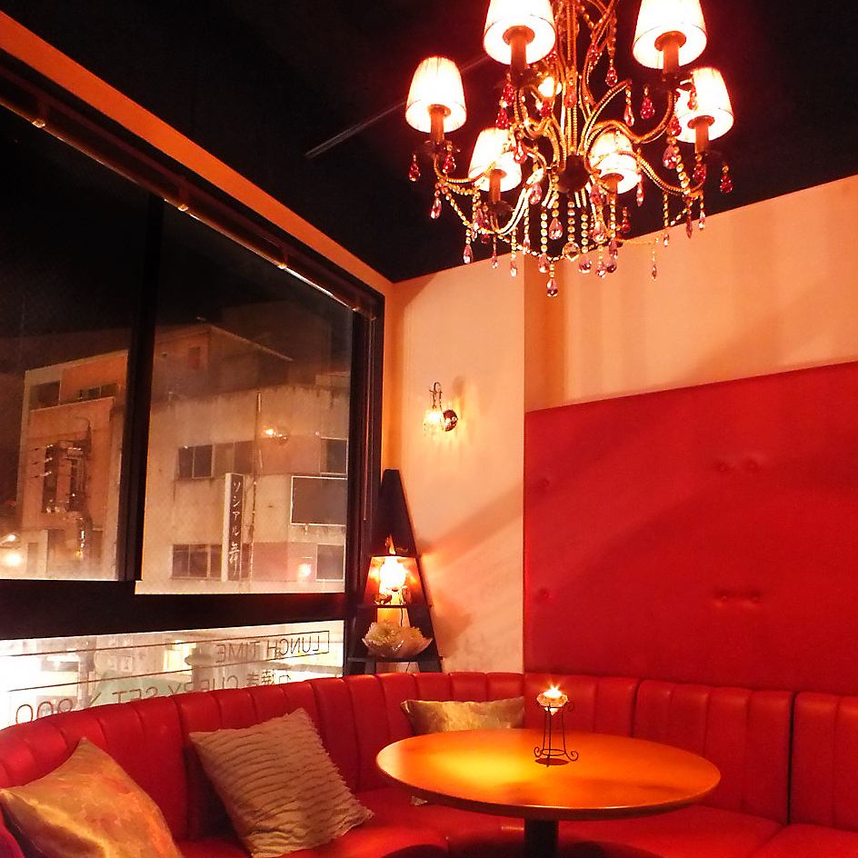There is a chandelier right above the red leather sofa seat ... ★ There is a couple seat